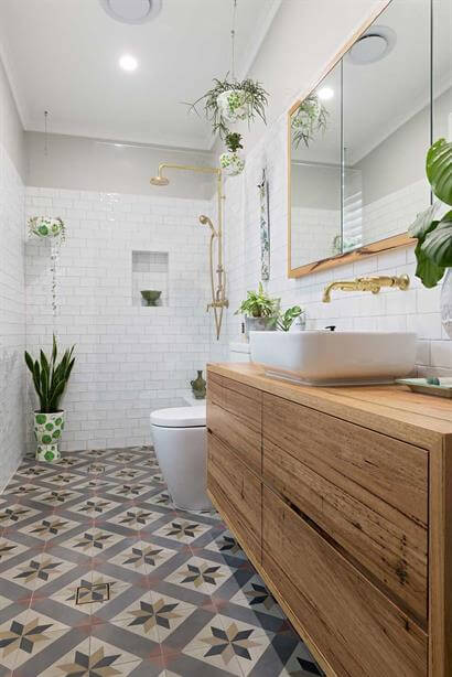 Encaustic floor tiles, recessed timber framed mirrored wall cabinet