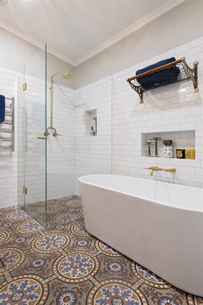 Above counter vanity basin with custom made brass wall mounted tapware
