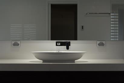 Classic freestanding basin and tapware with dramatic spot lighting