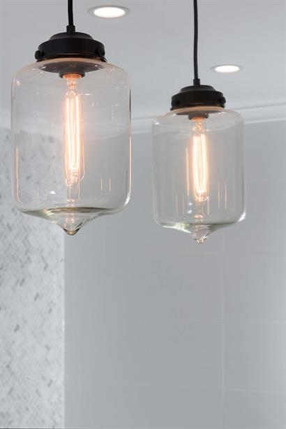 Modern bathroom lighting with hand-blown glass pendant lights and LED downlights 