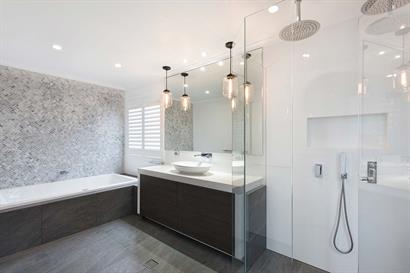 Sleek bathroom with marble and woodgrain accent features