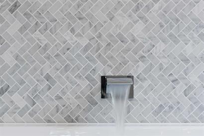Contemporary wall-mounted waterfall tap for modern bathroom