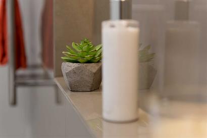 Bathroom accessories to create designer look in wall inset