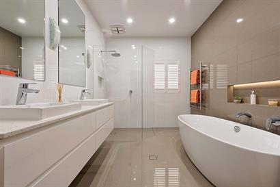 Large bathroom with freestanding bathtub and corner shower