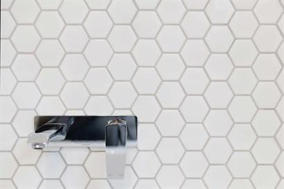 White hexagonal bathroom wall ties with Phoenix tap and mixer set