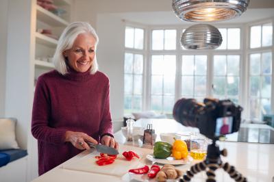 female blogger records video for cooking demonstration