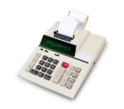 vintage calculator with text insurance on display