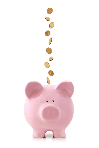 pennies falling into piggy bank