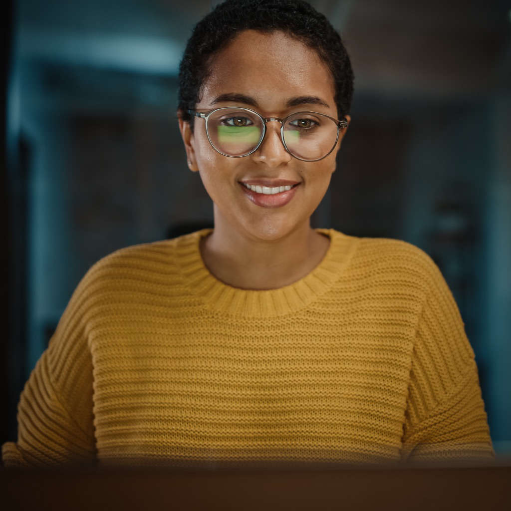 woman looking intently at laptop