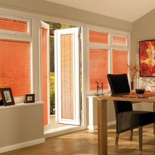 Orange Perfect Fit Venetian blinds in UPVC conservatory frames