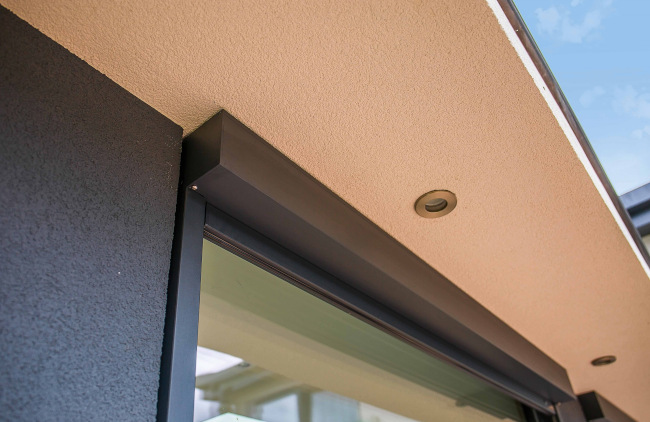 Close up of an external blind cassette under the roof edge