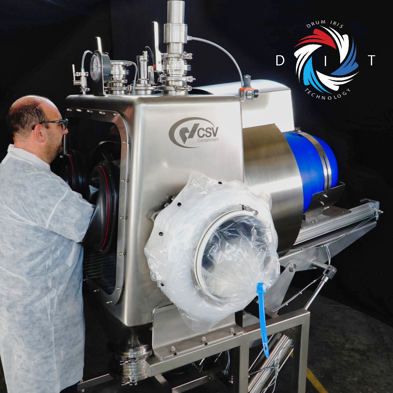 man accessing drum through rigid glove box