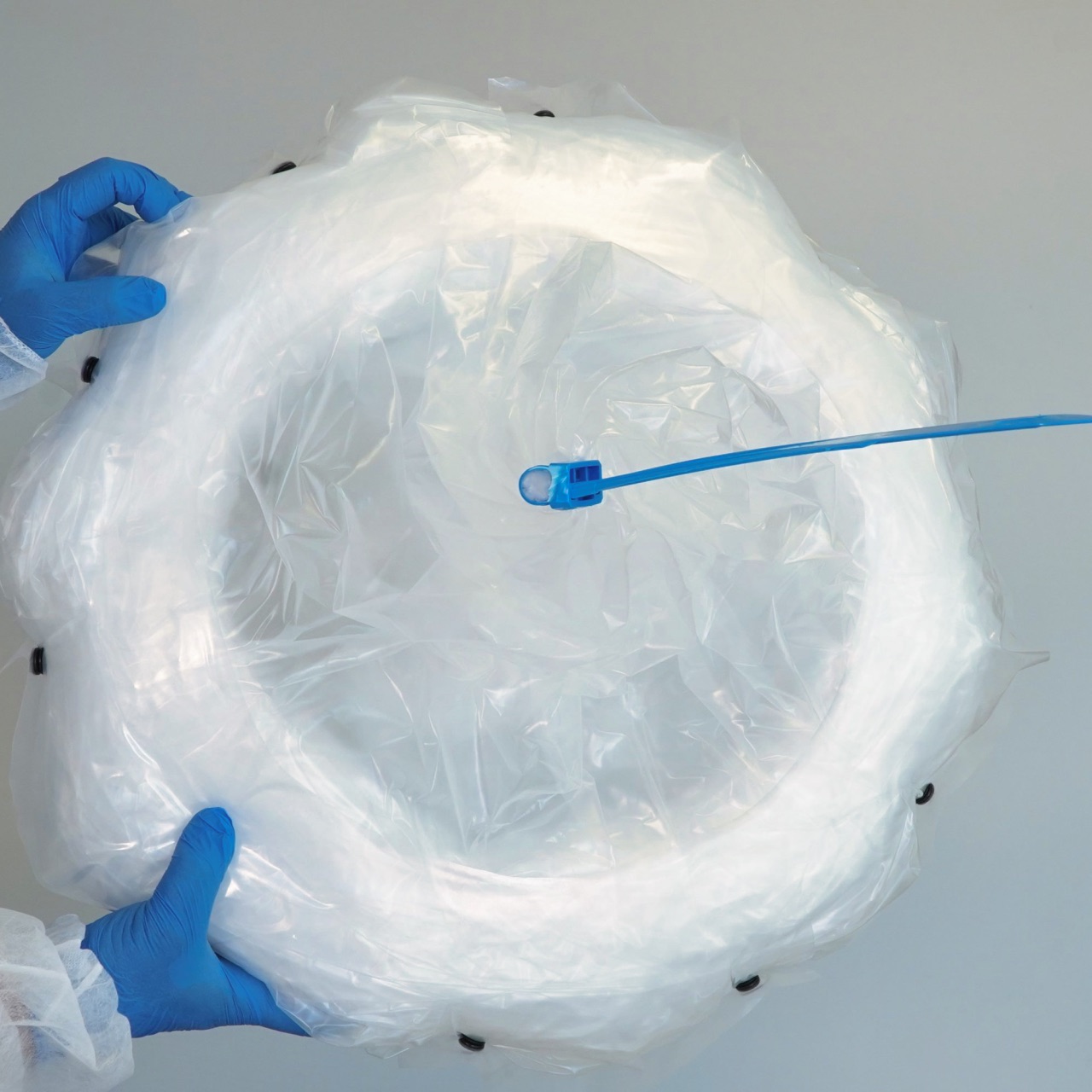 person holding continuous donut liners