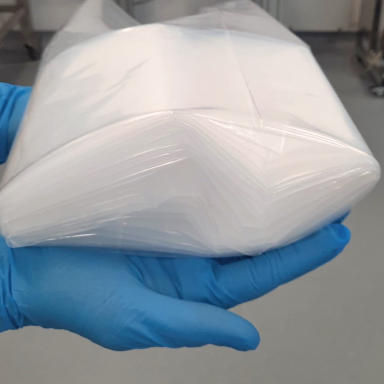 person holding continuous folded liners