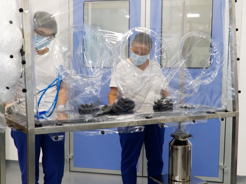workers decontaminating tools