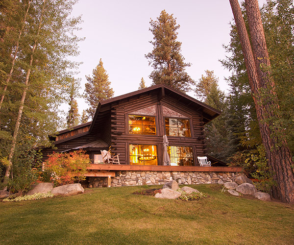 a log home exterior among the pines