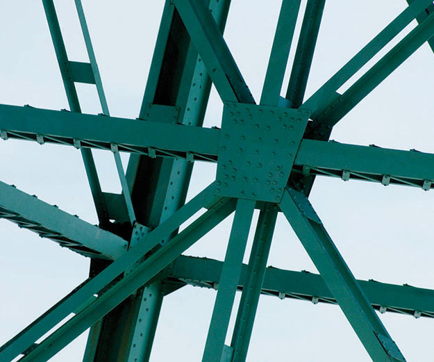 green girders against blue sky