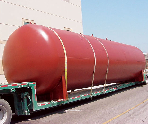 large painted tank on truck trailer