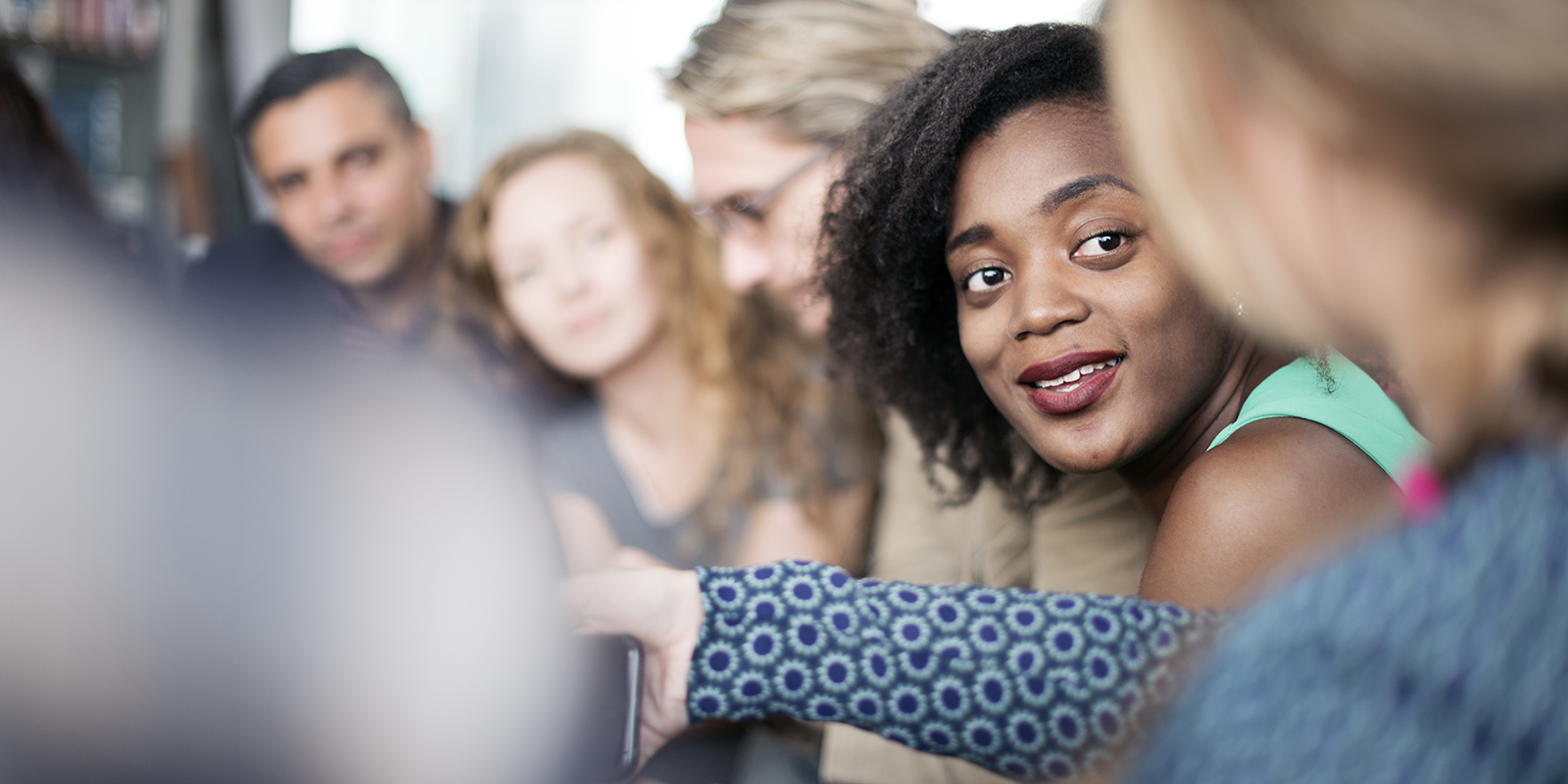 image of young black woman working in a group