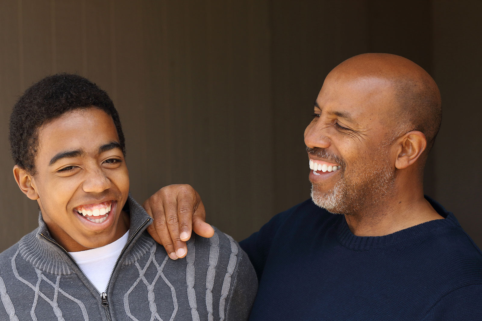 Teen sharing a laugh with his father