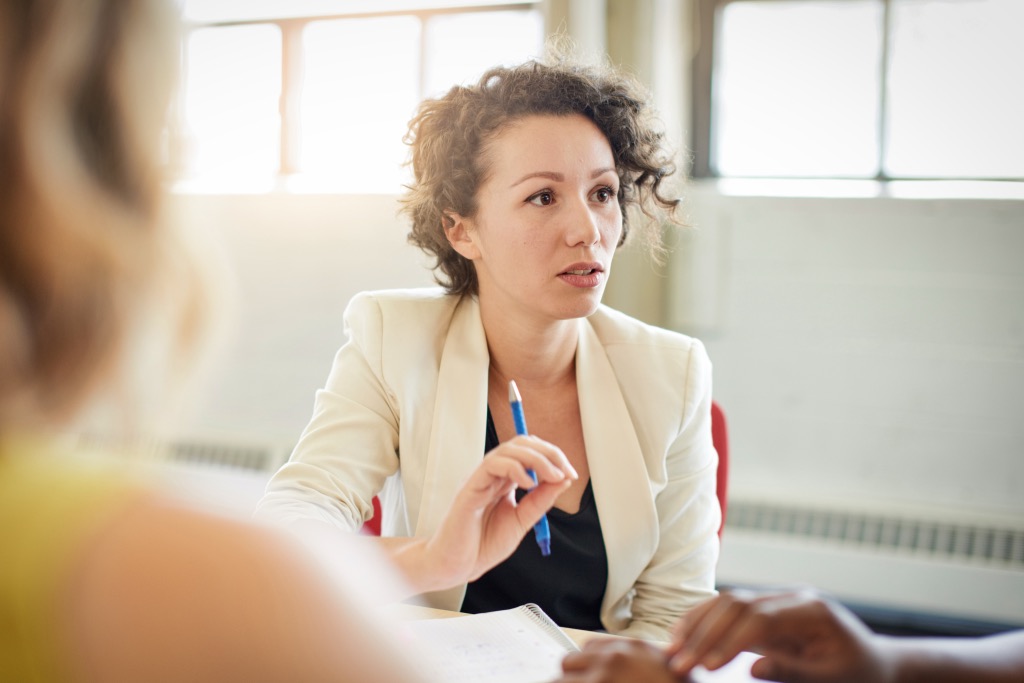 young woman talking to someone