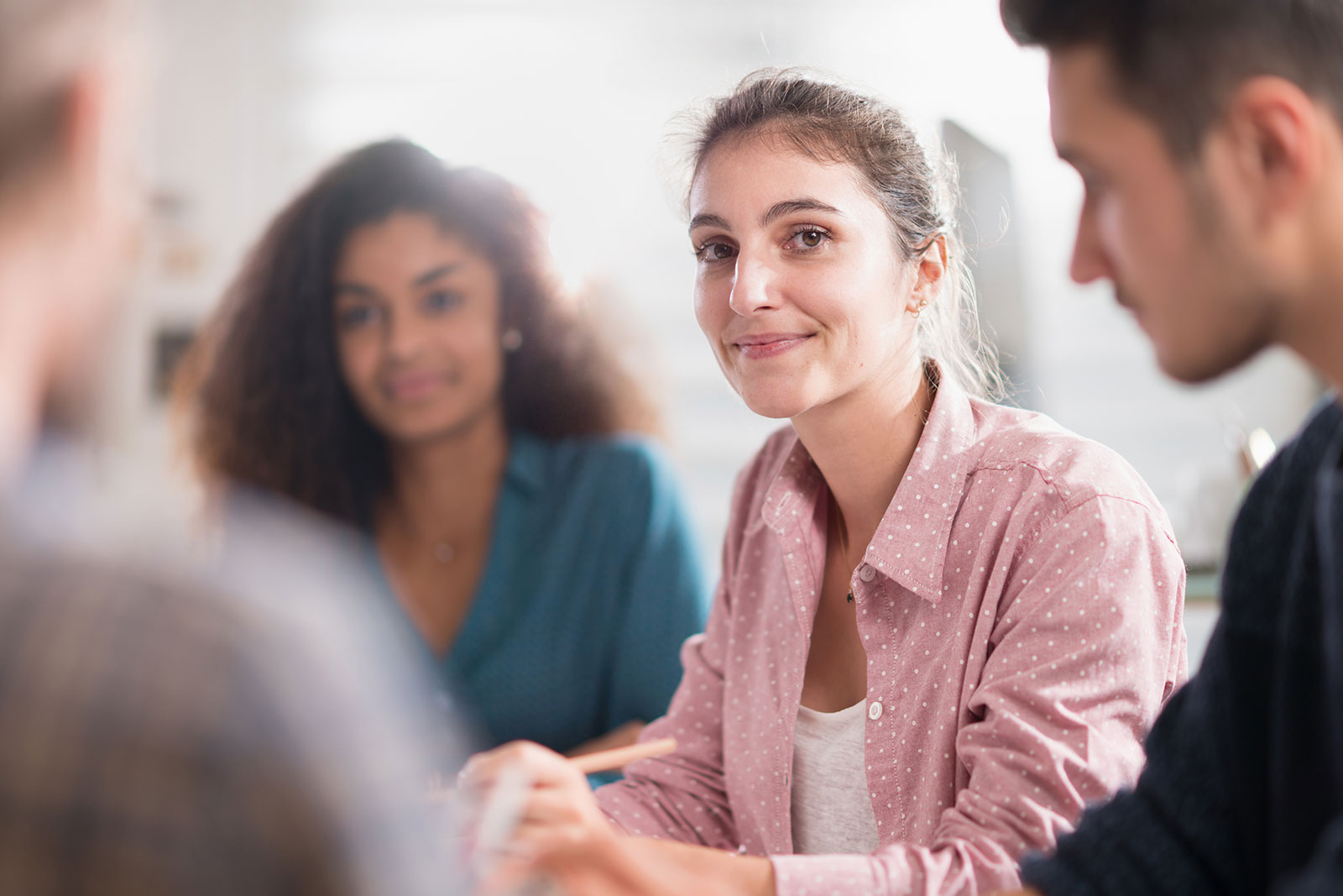 image of young woman working in a group