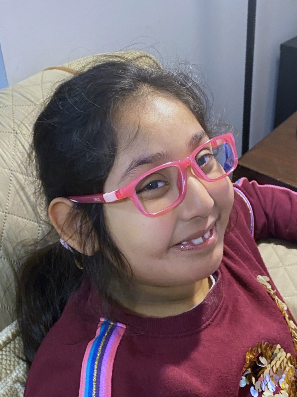 young girl wearing glasses