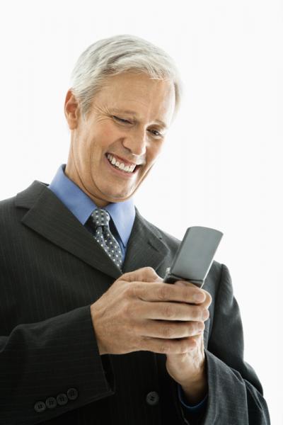 businessman sends a text message