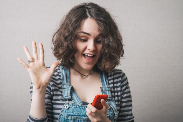 woman reads good SMS message