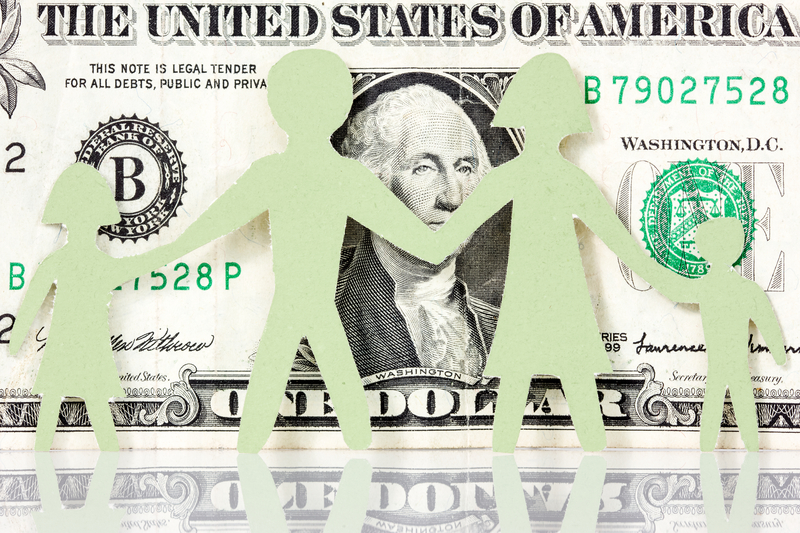 paper family on one dollar bill background