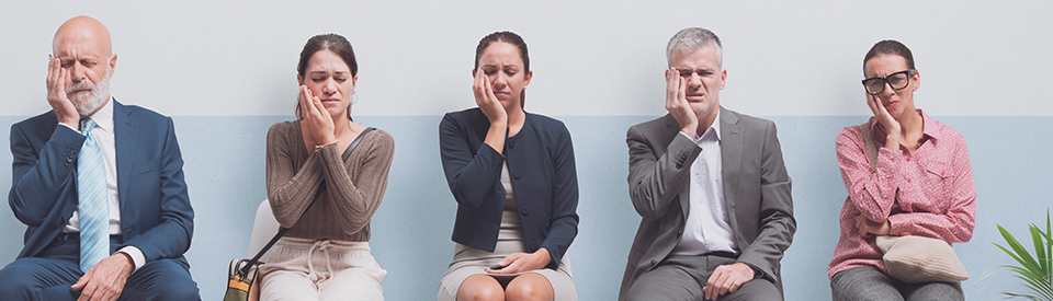 Group waiting in dentist office while dealing with dental emergency.