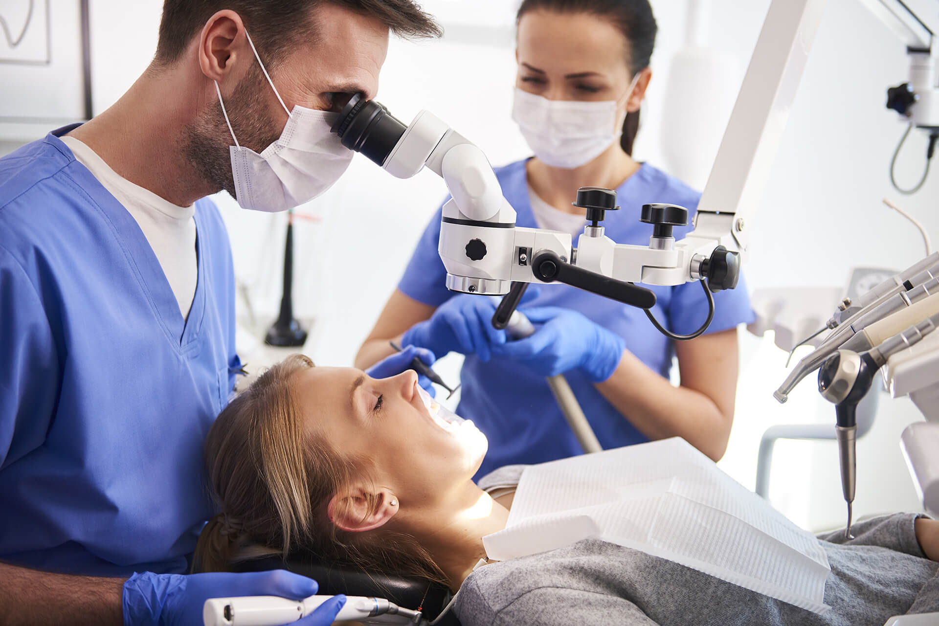 dentist inspecting patient closely
