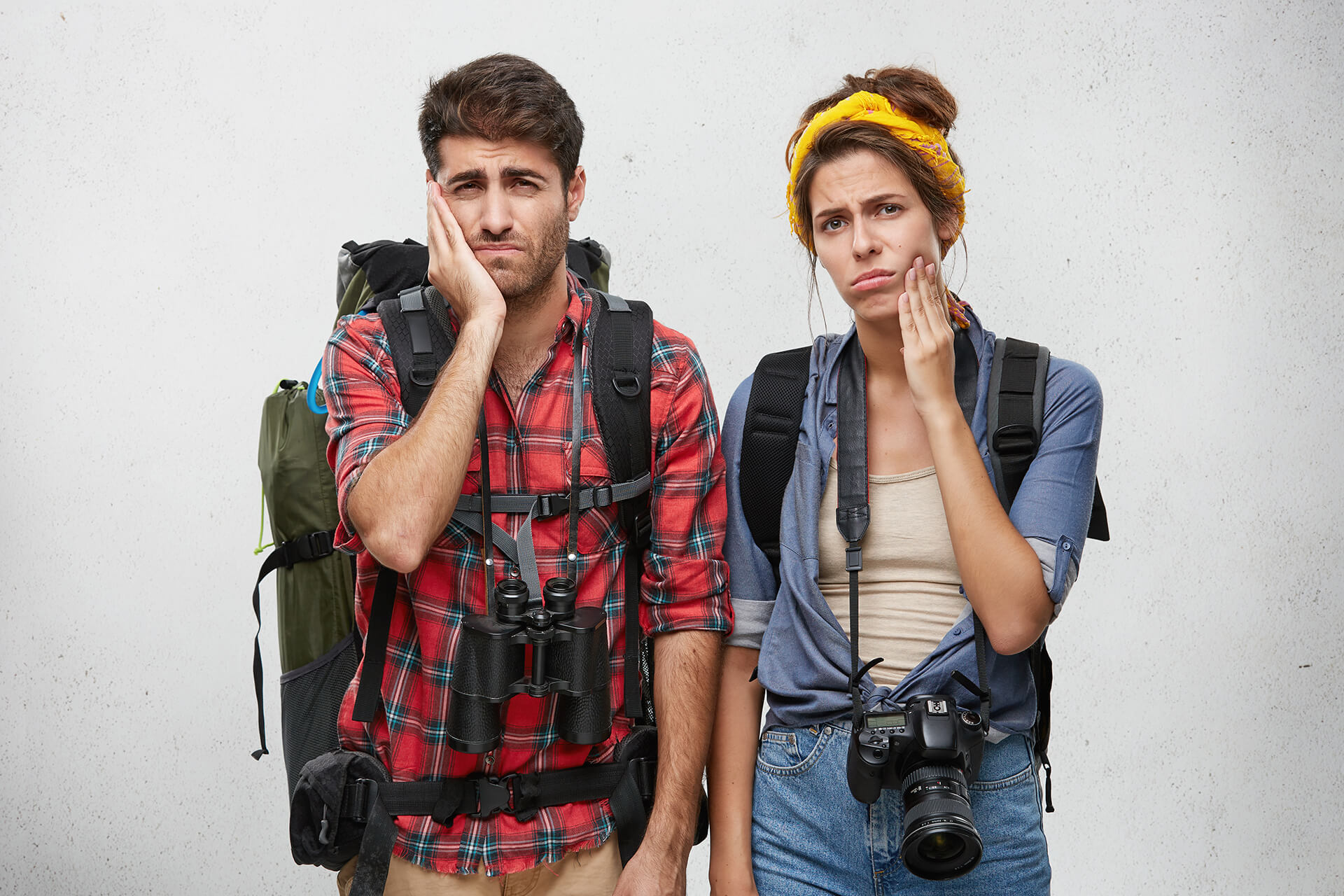 hikers holding their jaws in pain