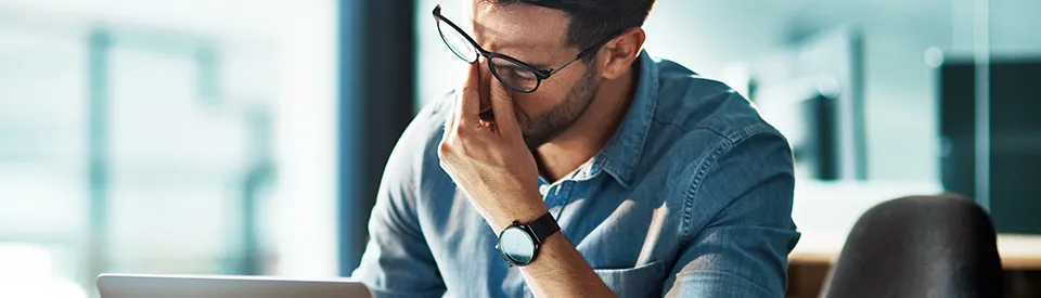 man stressed out while at the computer
