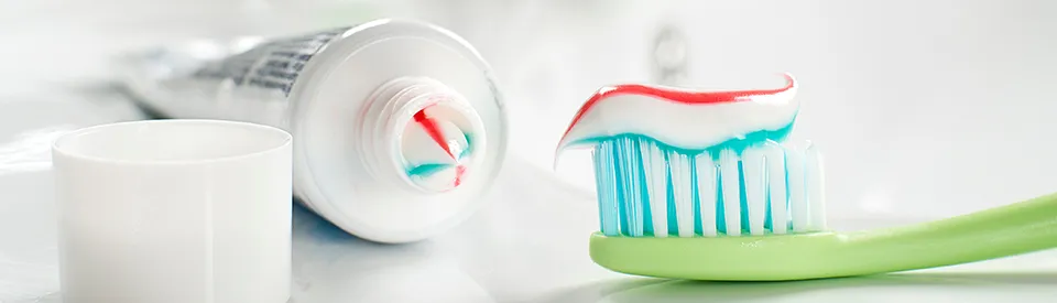 tooth paste bottle and tooth brush