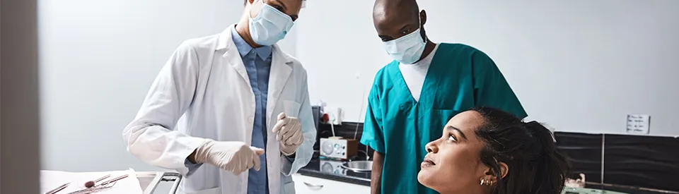 dentists advising patient in office