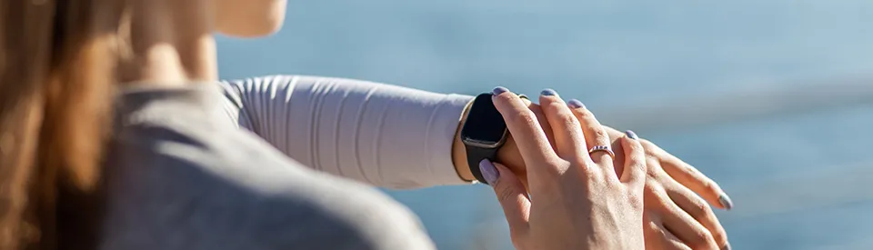woman checking smartwatch