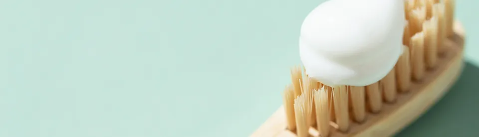 toothbrush with white toothpaste