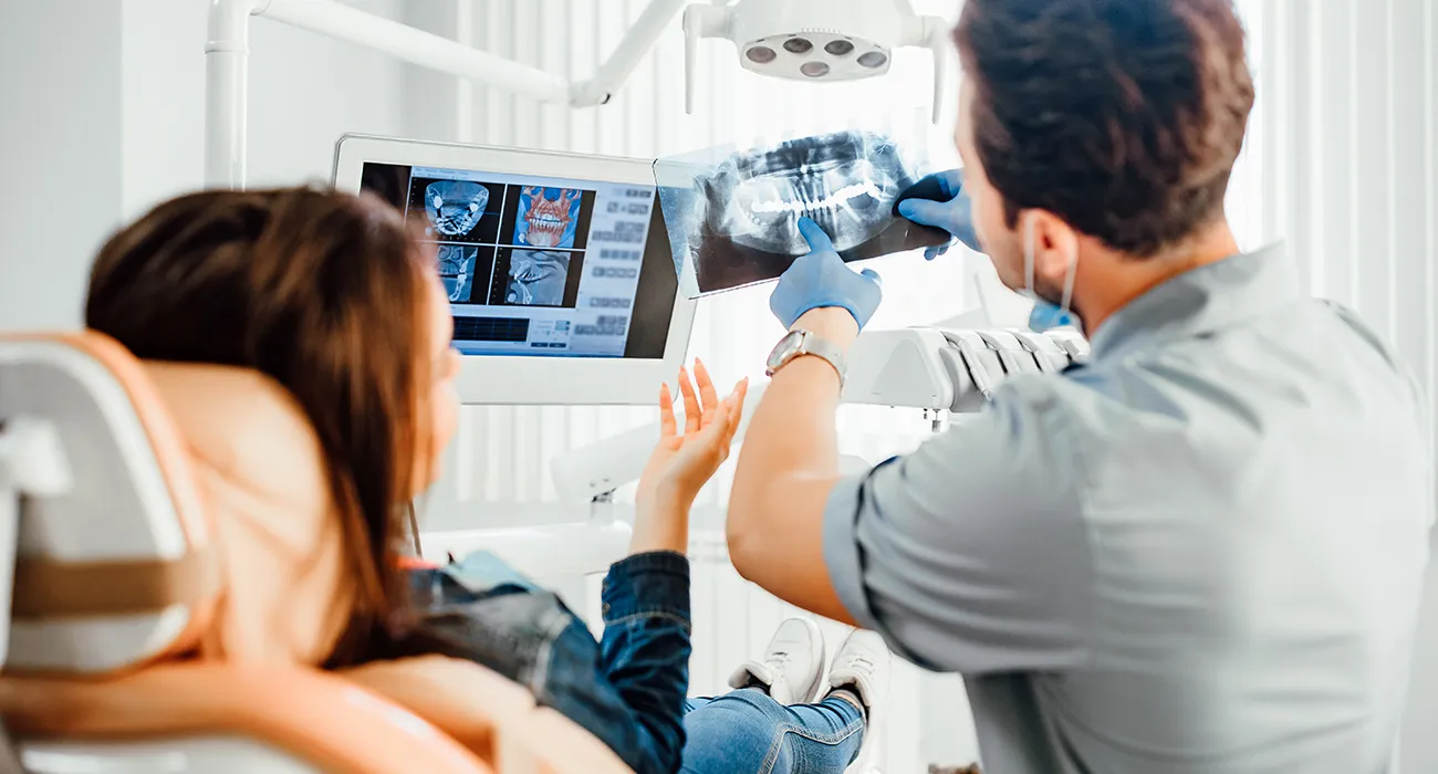 dentist reviewing xray with patient