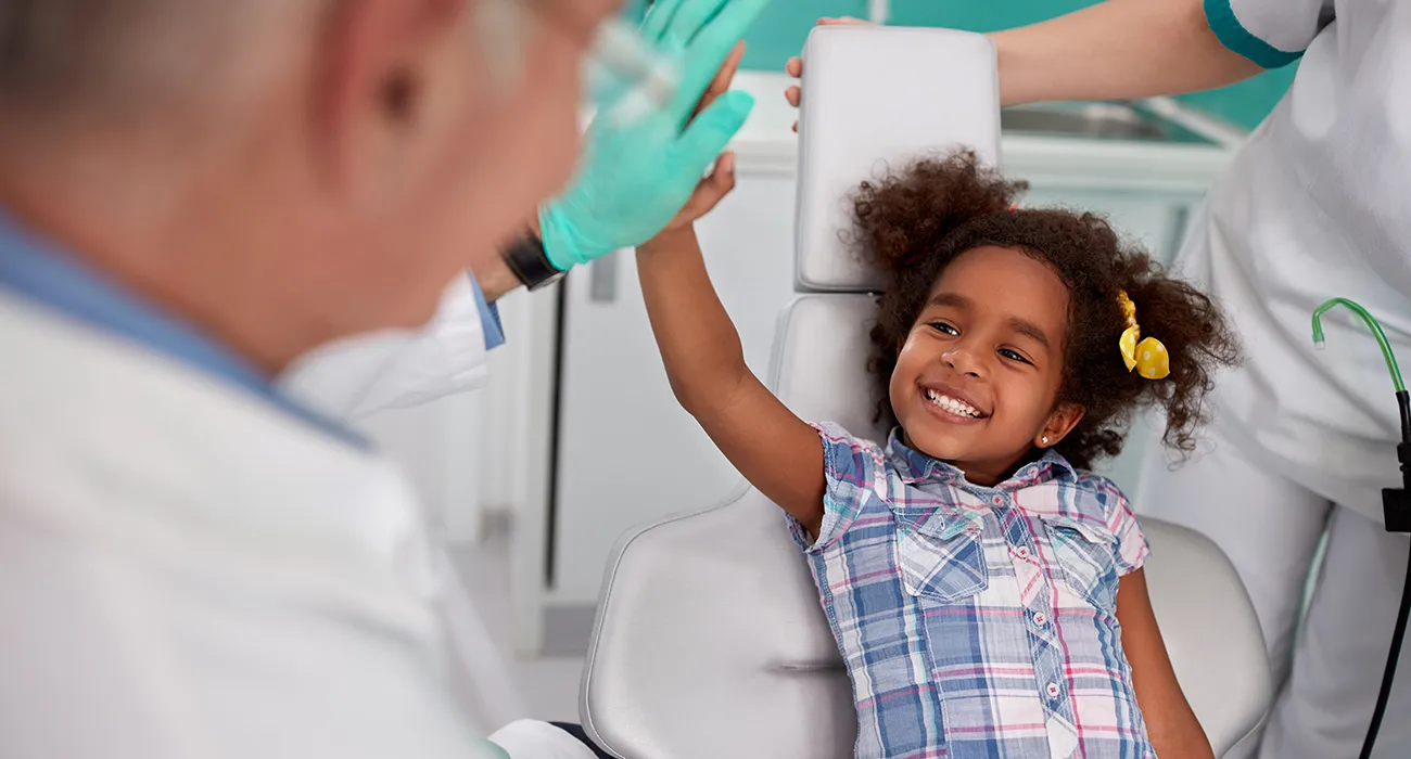 child's happy after dentist inspection