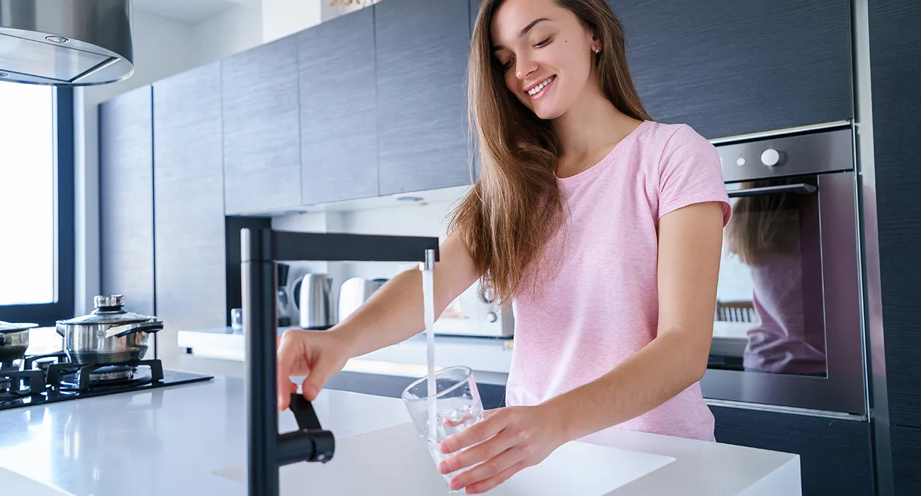 woman getting a glass of water