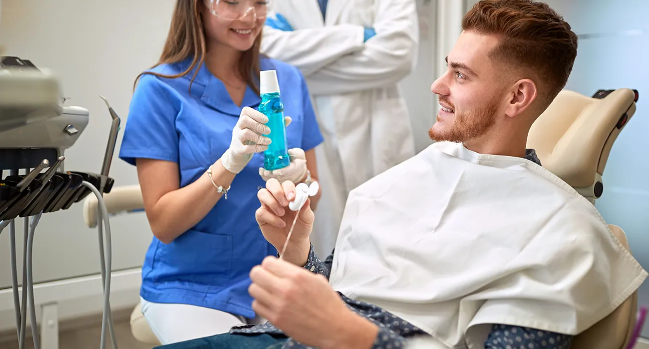 dentist informing patient about mouth wash