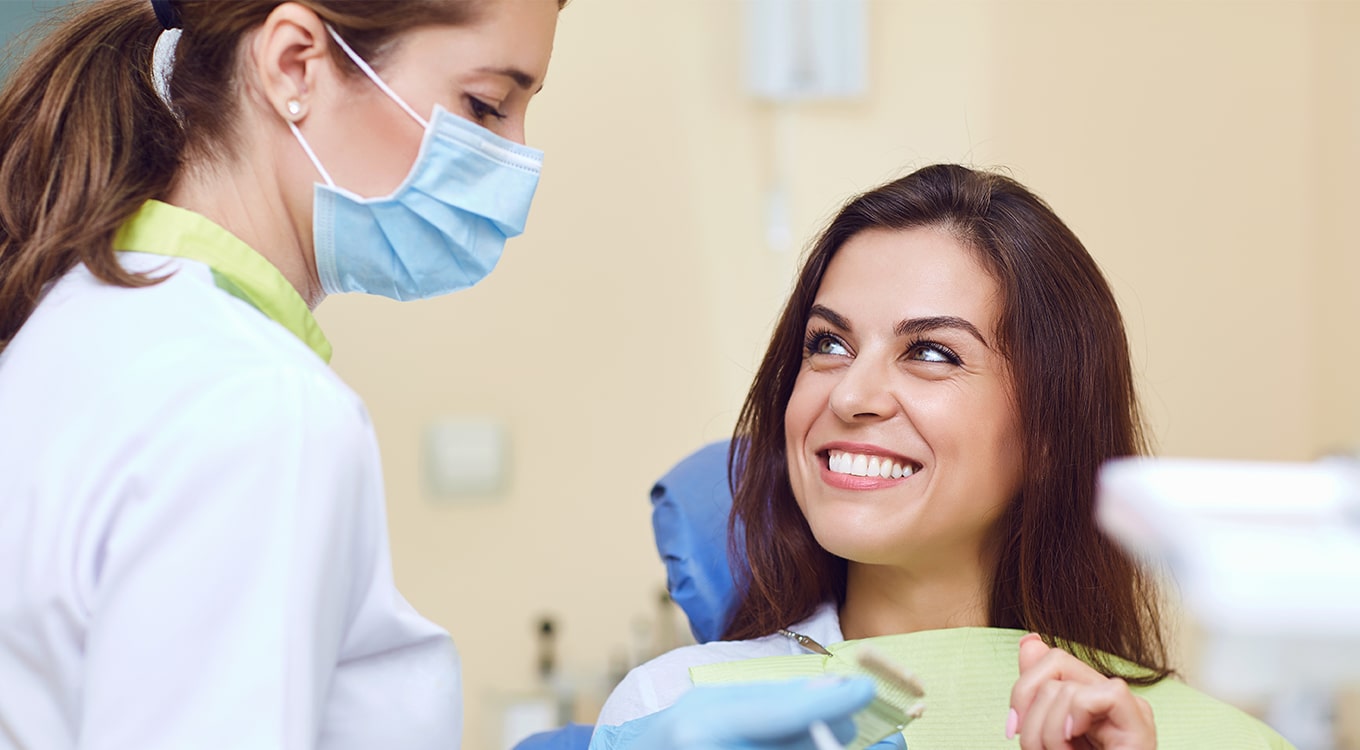 Emergency Dentist 24/7 San Diego, CA woman with white teeth smiling at dentist