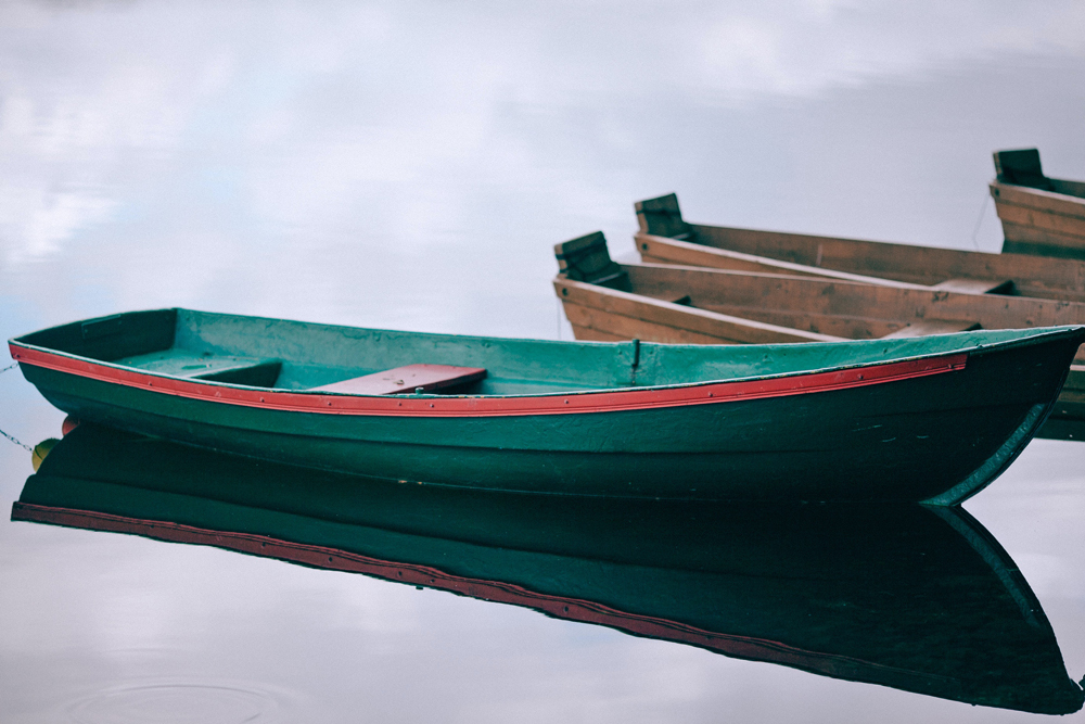 Dories in a small harbor. Photo by Maria Orlova from Pexels