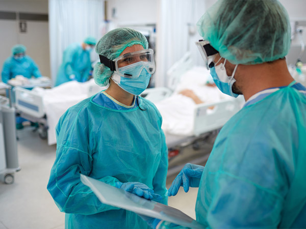 hospital staff in personal protective gear.