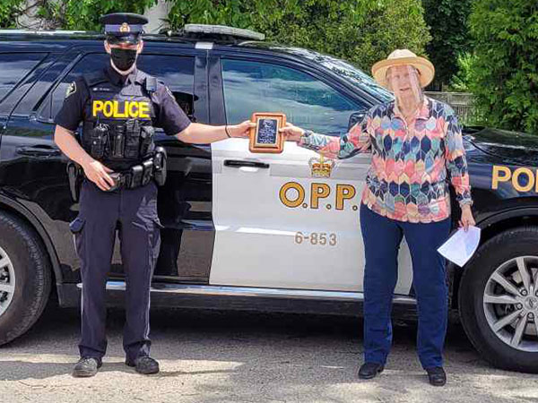 OPP Provincial Constable Nick Wilson and Grey Highlands Police Services Board Chairperson Lynn Silverton