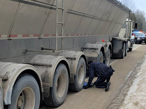 Opp checking load weight of truck