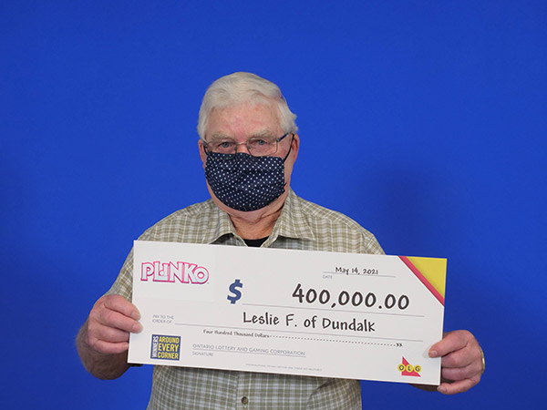 Leslie Franks holding the big cheque