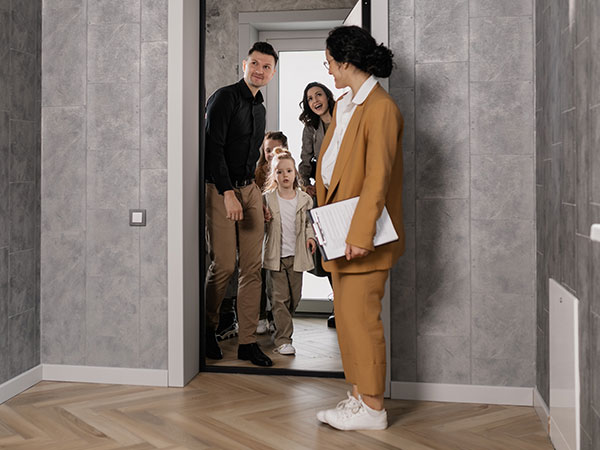 Home buyer family walking into apartment