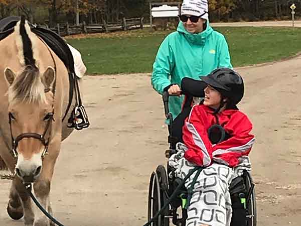 Hope haven disabled client leading horse